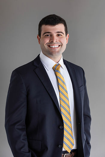 Miguel E. Del Rivero, LL Law Firm attorney, professional headshot in dark suit