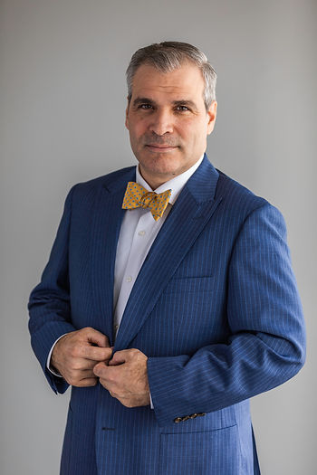 Giovanni Angles, LL Law Firm international arbitration attorney, professional headshot in blue suit