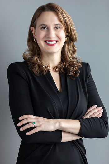 Tara J. Plochocki, LL Law Firm partner and asset recovery attorney, professional headshot in black outfit with arms crossed